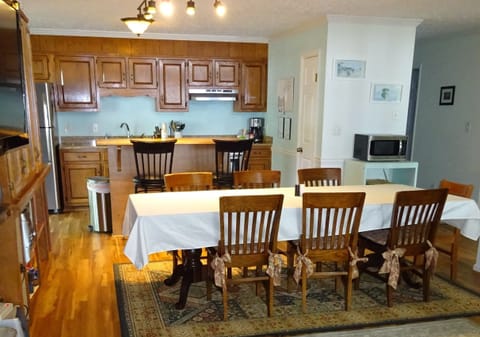 Dining table seats 6-8; seats at bar &more at side table beneath stairs 