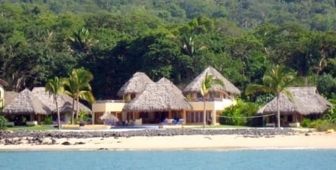 Las Palapas main building and 2 casitas.  200 feet of beach front.