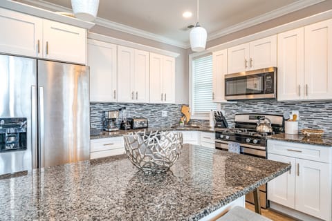 Bright dining area with seating for eight and balcony access
