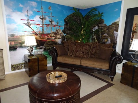 Living room with pirate ship mural and treasure chests