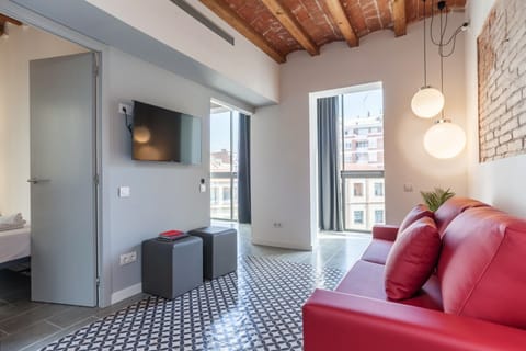 Comfortable living room with TV and dining area.
