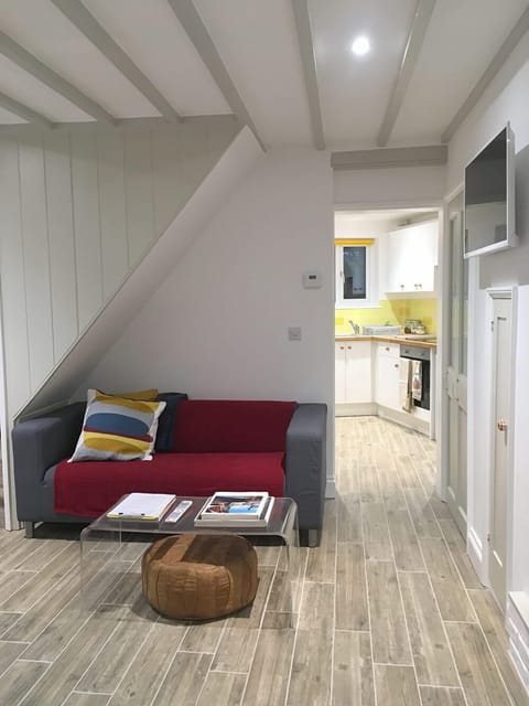 Sitting room through to kitchen.