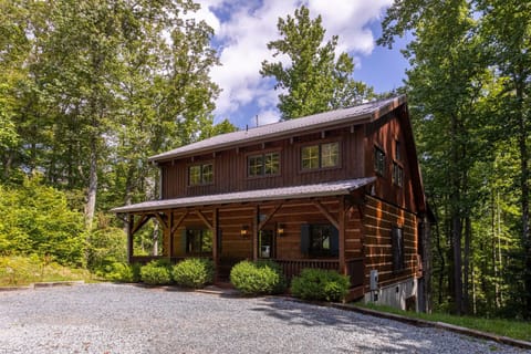 Tucked into the trees just outside Boone, Walk In The Clouds welcomes you with warm wood siding and a shady covered porch.