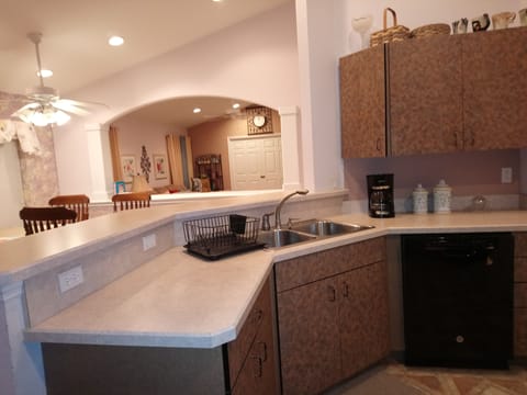 Kitchen with open view of dining room and living room