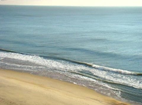 View of beach from balconies in living room and master bedroom
