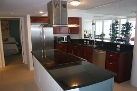 kitchen, looking into the second bedroom to left and master bedroom in far end.