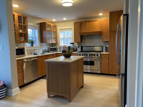Fully equipped/stocked kitchen plus adjacent laundry area/pantry