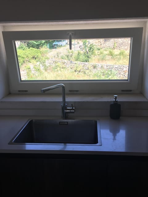 Sink and view back side of house