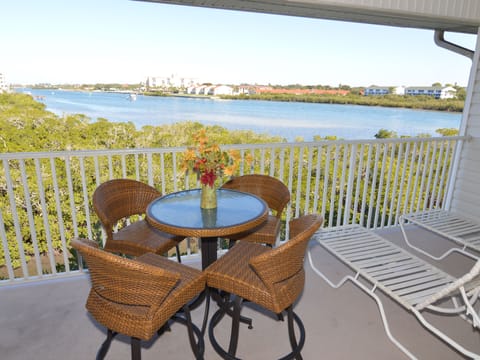 Seating for four on the balcony.  Bird watchers' delight!