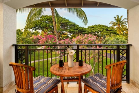 Covered lanai with views of tropical landscaping