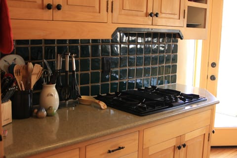 Custom tile throughout kitchen.