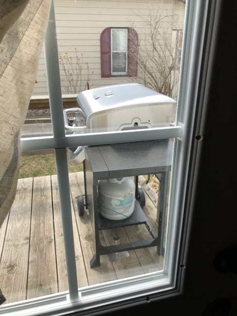 Side entry off dining where gas grill is located