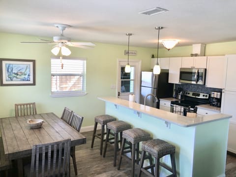 Table Seats 6 comfortably and counter seats 4.