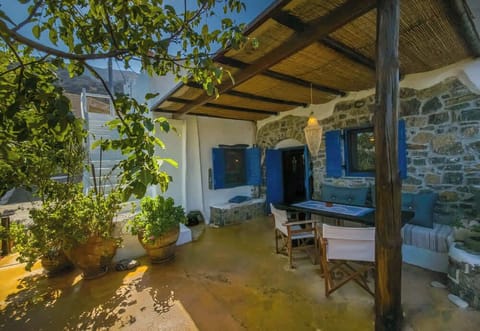 The terrace is surrounded by night flowers and has ample space for dining and enjoying the view.