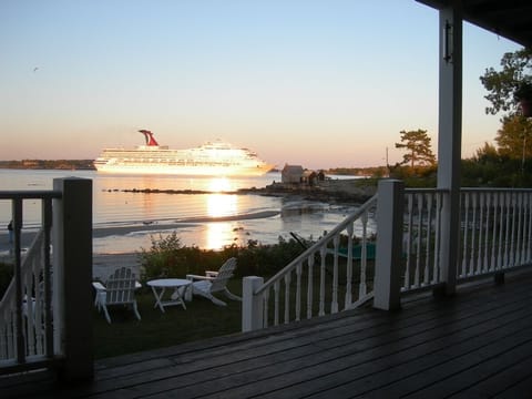  A cruise ship goes by at sunset