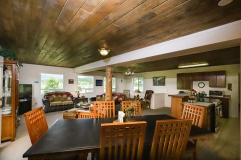 One large room with kitchen, dinning table & family room.