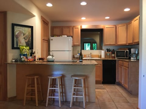 Well appointed kitchen with immaculate granite countertops and all you need.