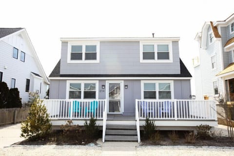 Large front porch with lounge chairs