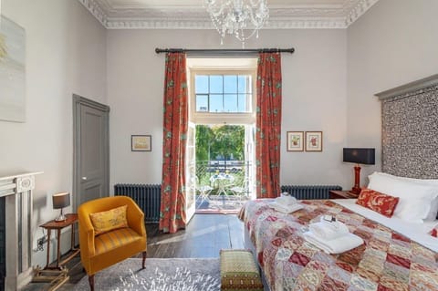 Spacious bedroom with private balcony overlooking the weir