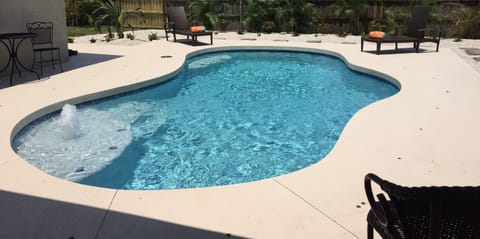 Paradise found. Resort style pool,sun shelf, seat, bubbler, grill, patio,play ar