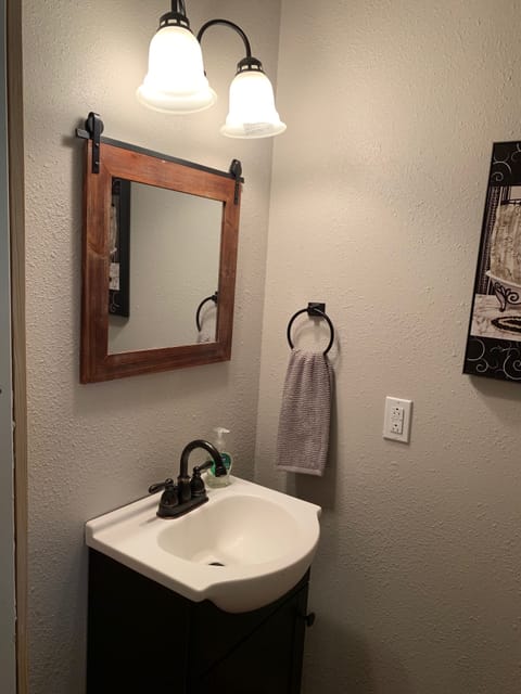 Half bathroom located in main living area. 