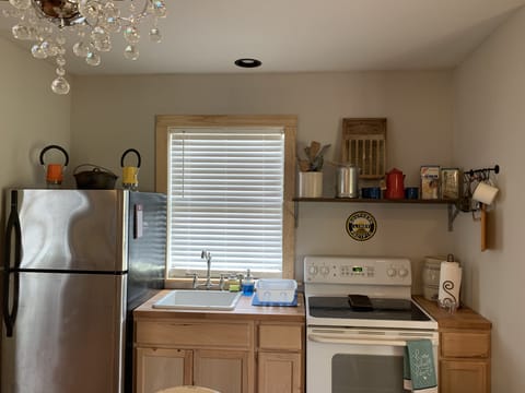 Full kitchen with fridge, stove, and microwave 