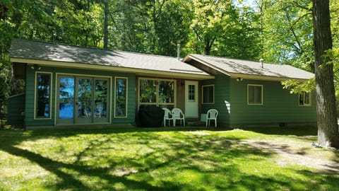 Big windows looking out at large private yard and lake. Gas grill provided
