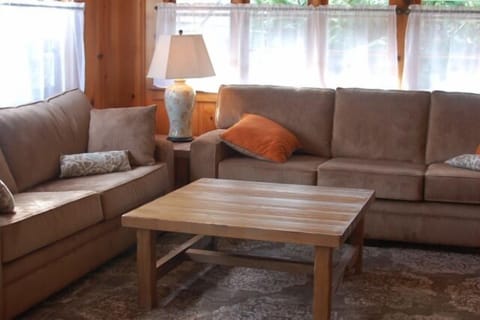 Spacious living room features seating for 9 people, rugs are made from recycled material, couches are Oregon-made.