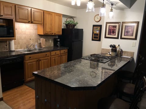 Kitchen w/counter and stools