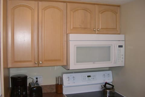 new appliances and wood cabinets in kitchen
