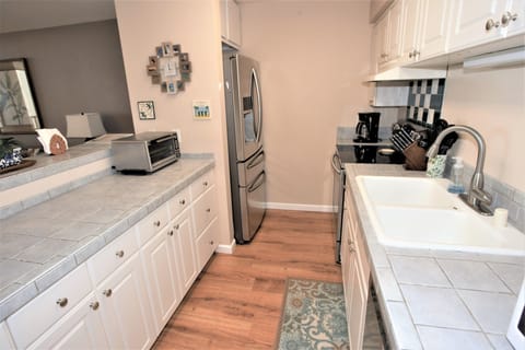 Fully Equipped Kitchen with Oven, Dishwasher, Refrigerator and Microwave