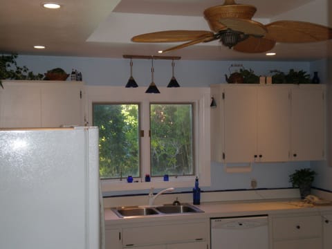 The kitchen sink overlooks the pool.