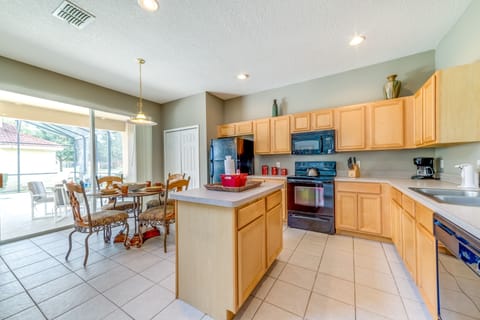 Large kitchen with view of the private pool