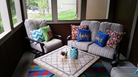 Lower Level screened patio with access to gas grill and walking trail