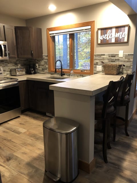 Newly renovated, poured concrete counters, farm sink