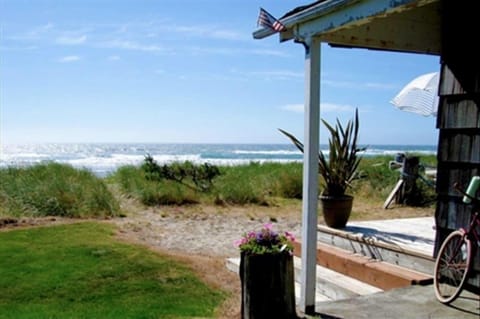 View from yard looking out onto ocean. No one is in front of you.