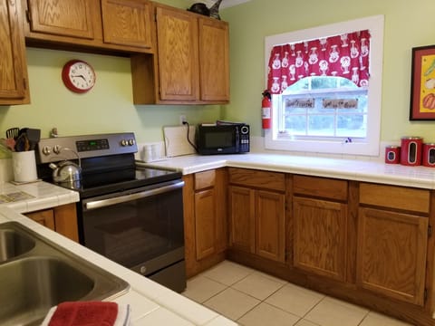 New stove and lots of pots and pans give you everything you need to eat in.