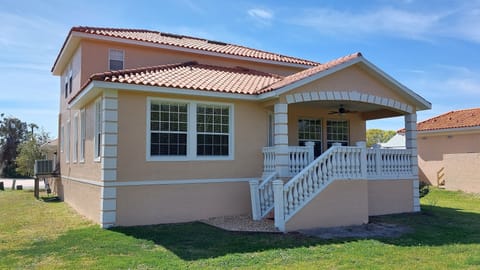 Canal entrance with covered porch and river views,