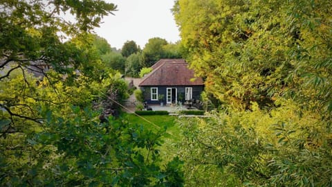 The Stables are nestled amongst the trees  with a south facing terrace.