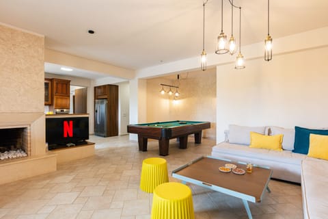 The playroom features a 50" HDTV,  PS4, as well as a fireplace.