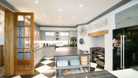 The kitchen adjoins the light filled dining area