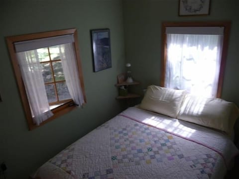 main bedroom, half bath and closet in room, shower accessible from both rooms