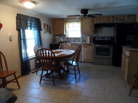 Dishes, glasses, silverware, pans, blender, fryer, toaster, can opener. 