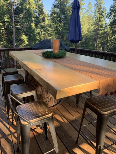 Dine outdoors on this beautiful Pine table made from reclaimed local trees.