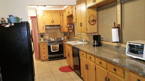 Plenty of cabinet space in the kitchen with granite countertops