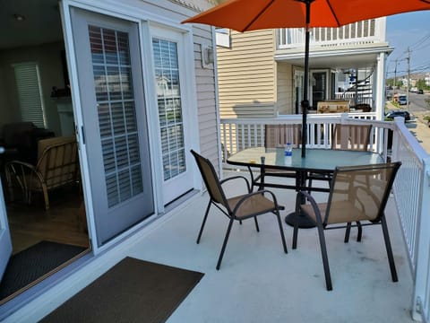 Front Deck with large table, 8 chairs, and end tables