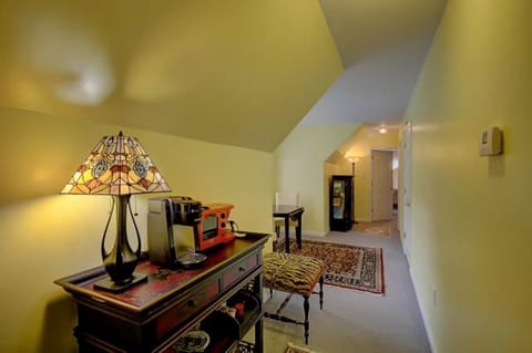 Upstairs hallway with fridge and kitchenette amenities