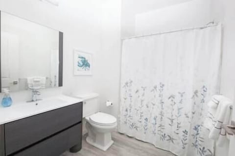 Spacious ADA-compliant bathroom with shower/tub combo for a refreshing or relaxing experience.