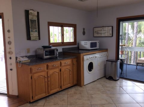 Quiet front load washer/dryer, Breville Smart oven, microwave. Long counterspace