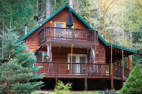 Around back! Upper and lower decks for relaxing and a good size yard for games!